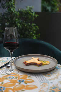 Close-up of wineglass on table