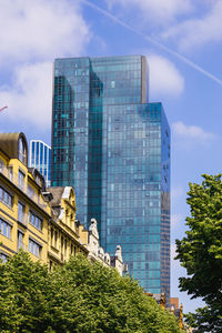 Low angle view of modern buildings against sky