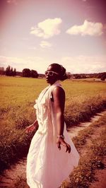 Woman standing on field