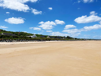 Scenic view of beach against sky house sunny day clear sky sandy normandie trees travel holiday 