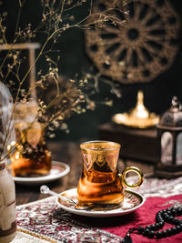 A glass of turkish tea on the table. conceptual stilllife photograhy with ramadan vibes concept