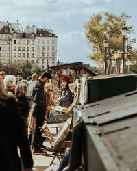 High angle view of people sitting on street