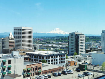 Modern buildings in city against sky