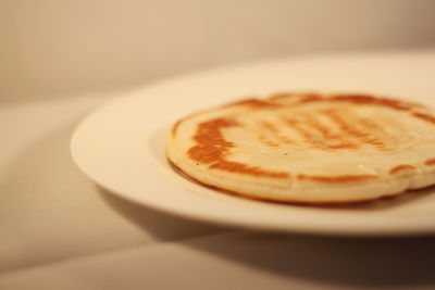 Close-up of pancake in plate on table