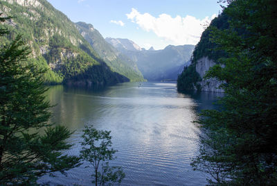 Scenic view of lake and mountains against sky