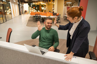 High angle view of business colleagues working in office