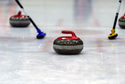 Close-up of curling stones on ice rink