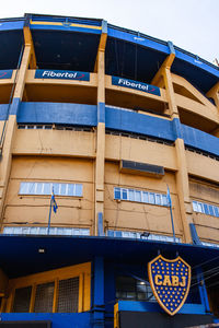 Low angle view of building against blue sky