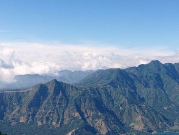 Scenic view of mountains against cloudy sky