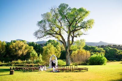 People standing at park during wedding ceremony