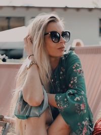 Portrait of young woman wearing sunglasses