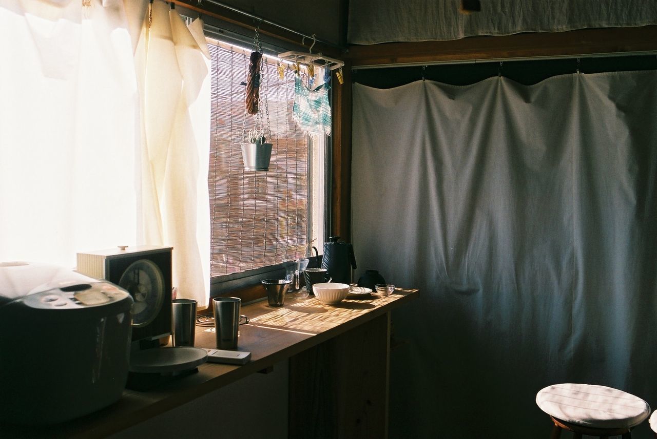 CLOTHES HANGING ON TABLE IN ROOM