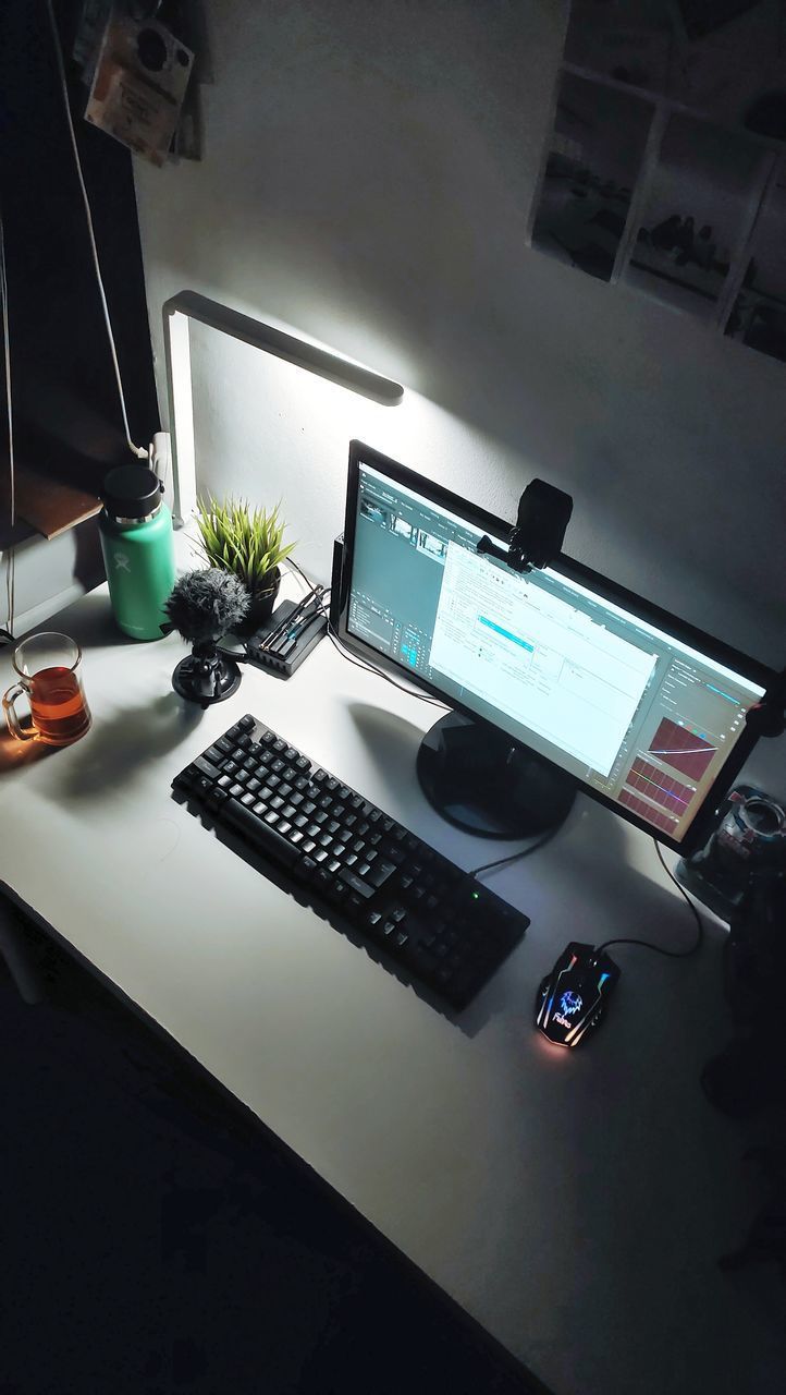 HIGH ANGLE VIEW OF CARS AND LAPTOP ON TABLE AT HOME