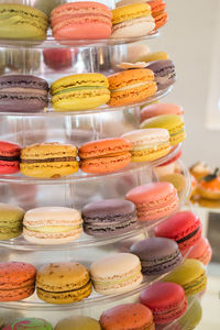 Close-up of multi colored macaroons for sale at store