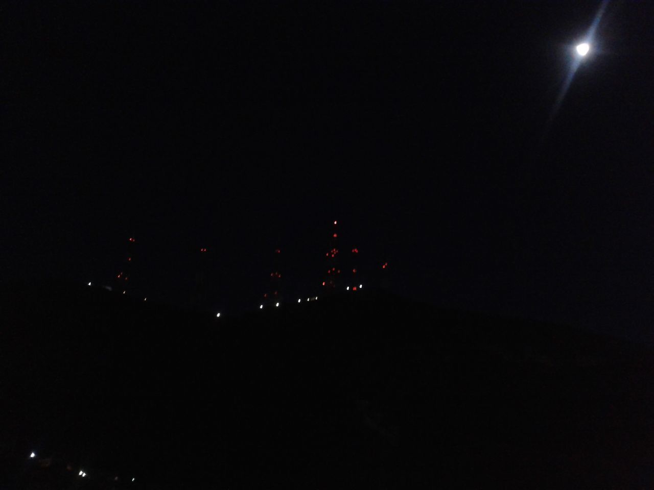 night, illuminated, moon, dark, copy space, clear sky, lighting equipment, low angle view, sky, light - natural phenomenon, street light, glowing, outdoors, star - space, astronomy, light, no people, full moon, city, built structure