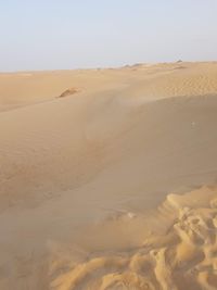 Scenic view of desert against clear sky