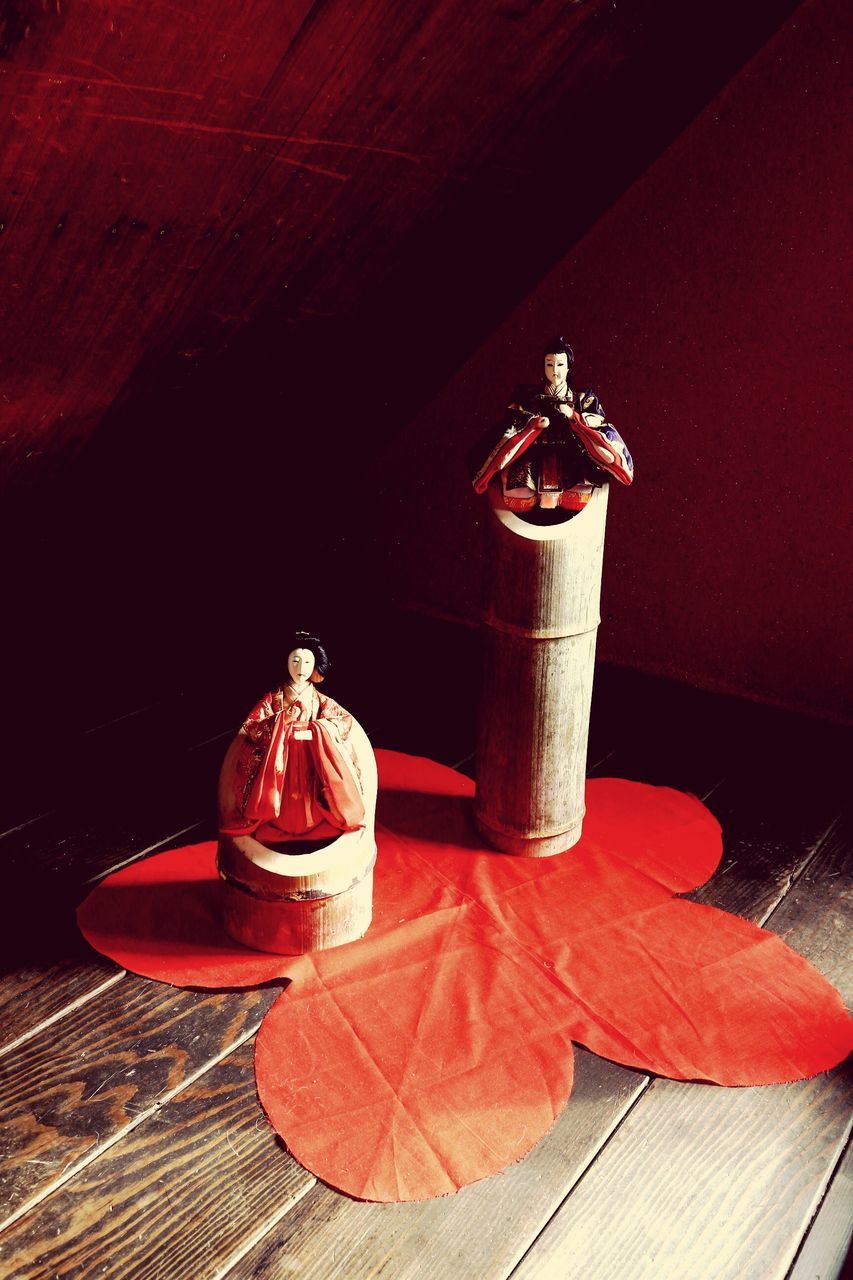 red, indoors, illuminated, wood - material, lantern, table, lighting equipment, night, hanging, still life, close-up, decoration, no people, metal, high angle view, wooden, wall - building feature, wood, tradition, home interior