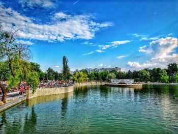 Scenic view of river against cloudy sky