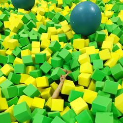 Cropped hands amidst toy blocks