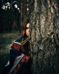 Portrait of a beautiful young woman in forest