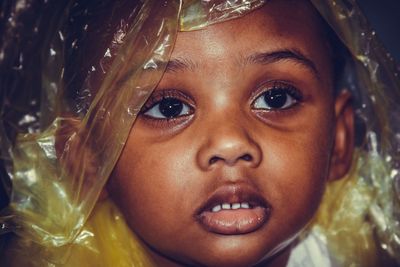 Close-up of girl wearing plastic