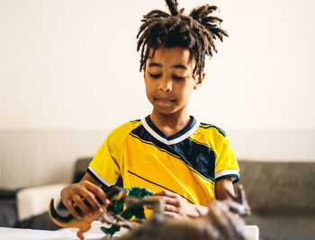 Boy playing with toys at home