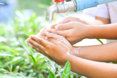 Close-up of woman hand with water