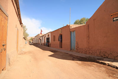 Footpath amidst buildings in town