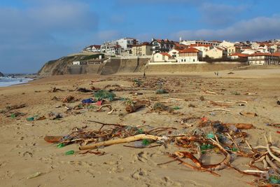 View of beach against buildings in city