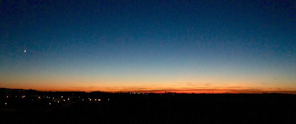 Scenic view of silhouette landscape against sky at night