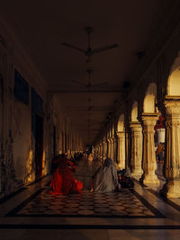 Rear view of man walking in tunnel