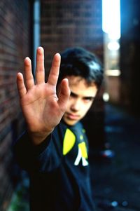 Boy showing stop sign