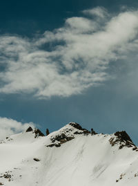 Snow covered mountains against sky