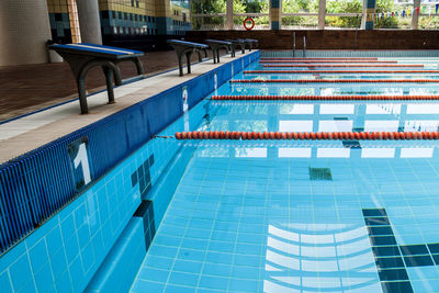 Starting block by swimming pool