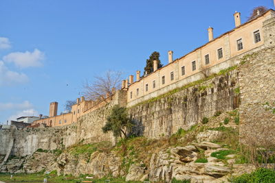 Low angle view of building against blue sky