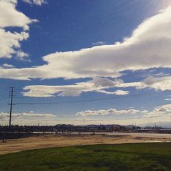 Scenic view of landscape against cloudy sky