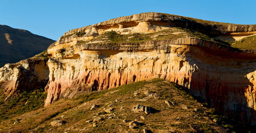 Rock formations on mountain against sky