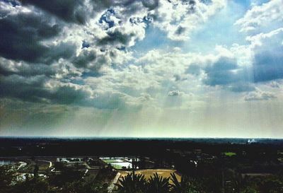Scenic view of landscape against cloudy sky