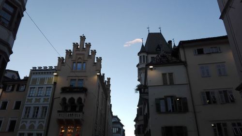 Low angle view of buildings against blue sky