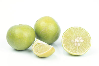 Close-up of fruits against white background