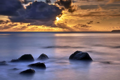 Scenic view of sea against sky during sunset