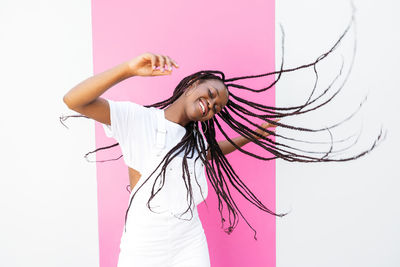 Rear view of woman standing against white background