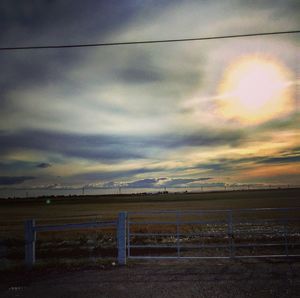 Scenic view of landscape against cloudy sky