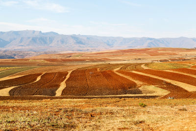 Scenic view of arid landscape against sky