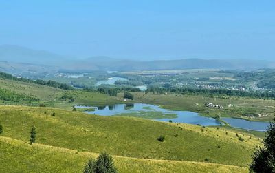 Lake and river katun in the foothills of altai on a sunny summer day, russia