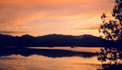 Scenic view of lake at sunset