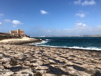 Scenic view of beach against sky