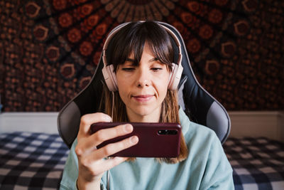 Portrait of mid adult man using mobile phone