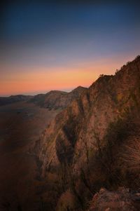 Scenic view of mountains against sky during sunset