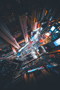 High angle view of illuminated buildings in city at night